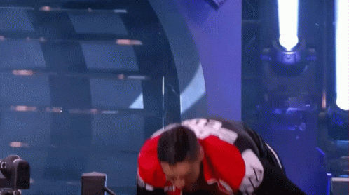 Man in Red White Black Jacket and Shorts