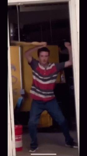 Man in Red White Blue Striped Shirt Dancing
