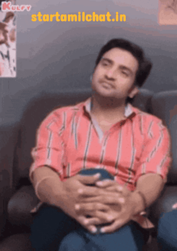 Man In Red White Striped Shirt On Couch GIF
