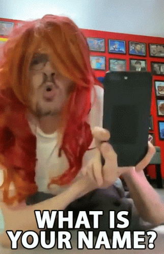 Man in Red Wig Holding Cell Phone Asking What Is Your Name