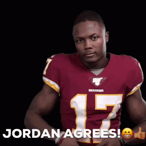 Man in Redskins Jersey Thumbs Up