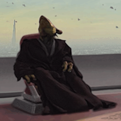 Man in Robe Sitting in Chair