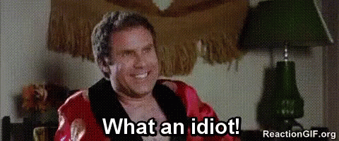 Man In Robe Sitting In Chair Smiling GIF