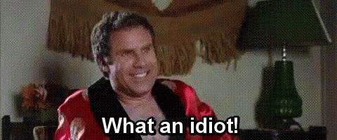 Man In Robe Sitting In Chair Smiling GIF