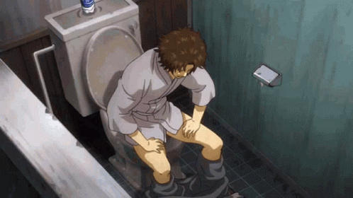 Man in Robe Sitting on Toilet