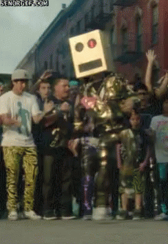 Man In Robot Costume Dancing With Cardboard Box GIF