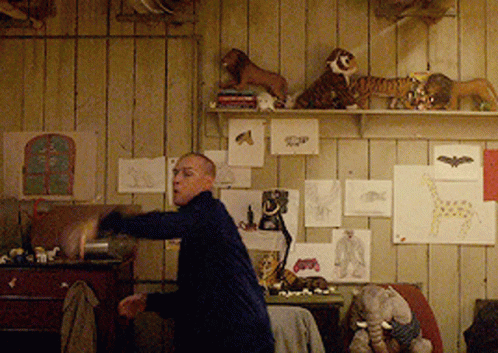 Man in Room With Stuffed Animals