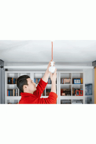 Man In Safety Glasses And Hard Hat Working On Circuit Board GIF