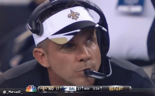 Man in Saints Visor Watching Game