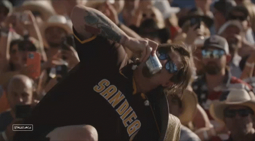Man In San Diego Jersey Drinking Beer GIF