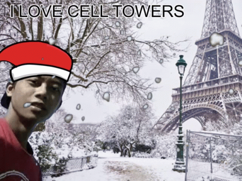 Man in Santa Hat at Snowy Eiffel Tower