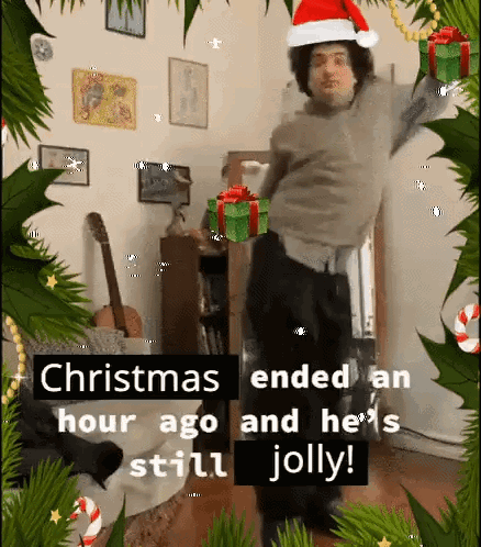 Man In Santa Hat Dancing At Christmas GIF