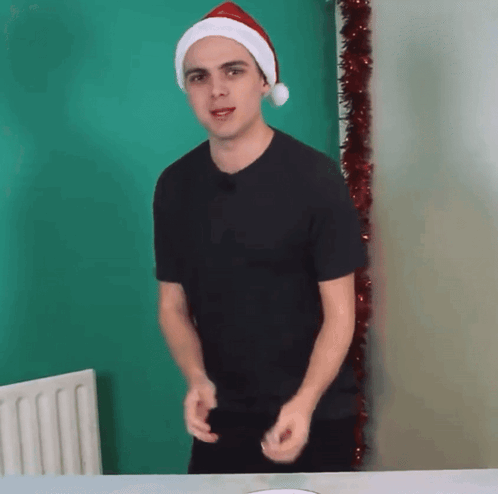 Man In Santa Hat Dancing GIF