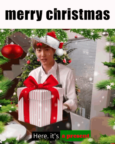 Man In Santa Hat Holding Gift GIF