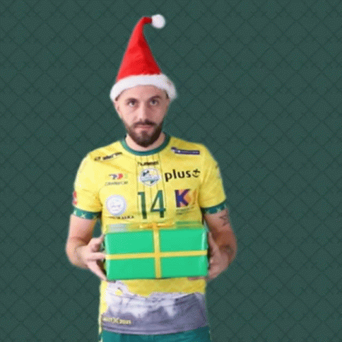 Man in Santa Hat Holding Green Gift Box
