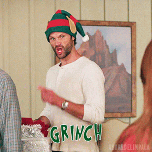 Man in Santa Hat Says Grinch