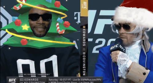 Man In Santa Hat Talking Into Microphone GIF