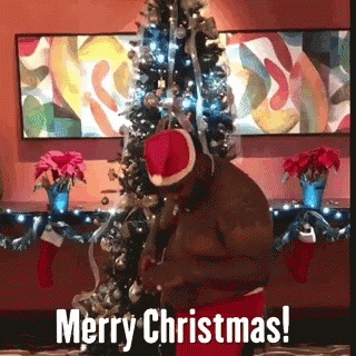 Man in Santa Hat Wishing Merry Christmas