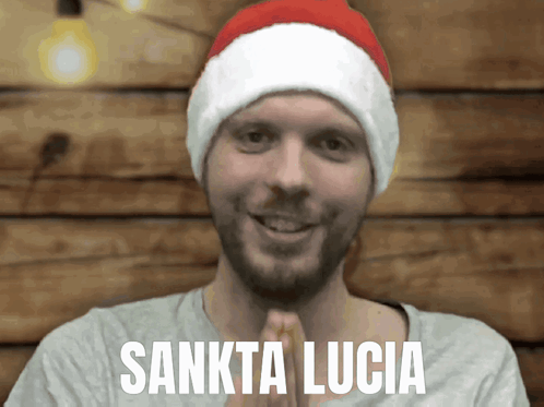 Man in Santa Hat With Sankta Lucia