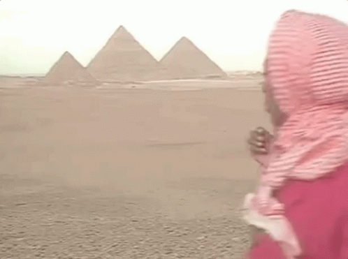 Man in Scarf and Red Shirt at Pyramids