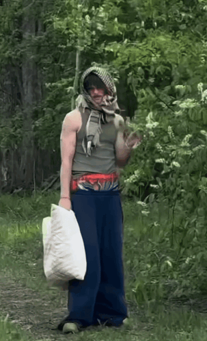 Man In Scarf Holding Moncler Bag GIF