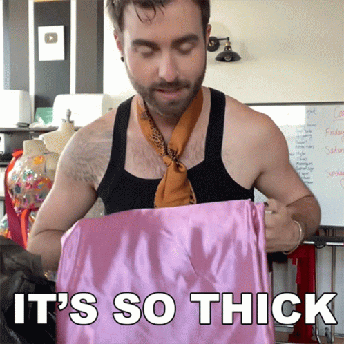 Man in Scarf Holding Pink Cloth Saying It's So Thick