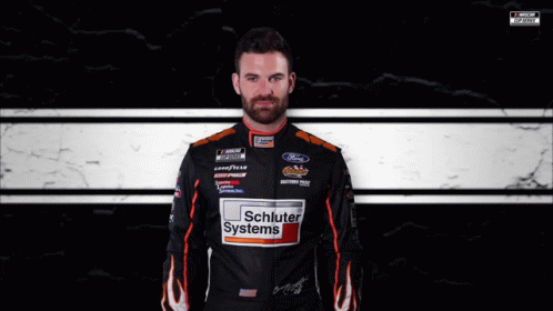 Man in Schluter Systems Jacket at Race Track