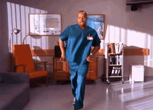 Man In Scrubs Dancing In Hospital GIF