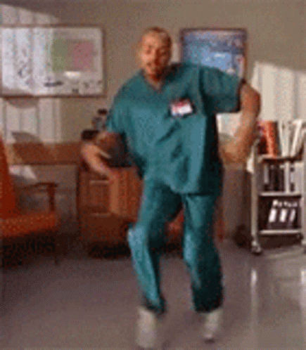 Man In Scrubs Dancing In Hospital GIF