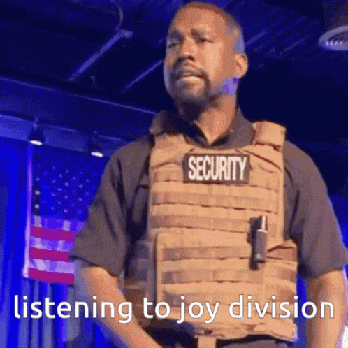 Man In Security Vest Listening To Joy Division GIF