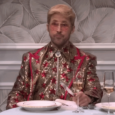 Man in Sequined Suit with Champagne and Plates