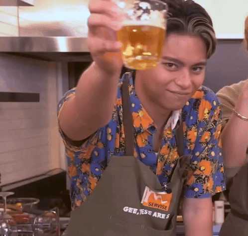 Man in Servise Apron Holding Beer