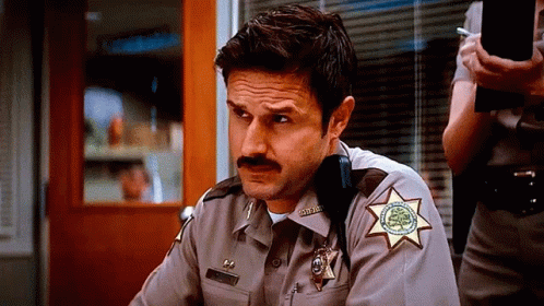 Man in Sheriff's Uniform With Mustache and Star