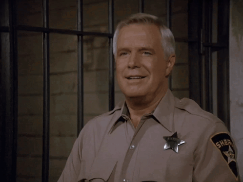 Man in Sheriff Uniform With Sheriff Badge
