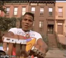 Man in Shirt Saying Bed Guy Holding Skateboard