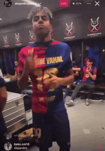 Man in Shirt Saying Nine Vanal in Locker Room