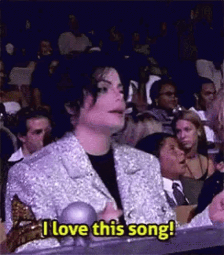 Man in Silver Jacket Saying I Love This Song