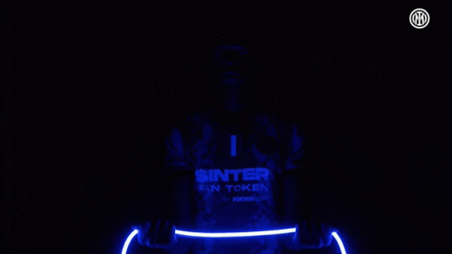 Man in Sinter Fan Token Jersey Holding Light