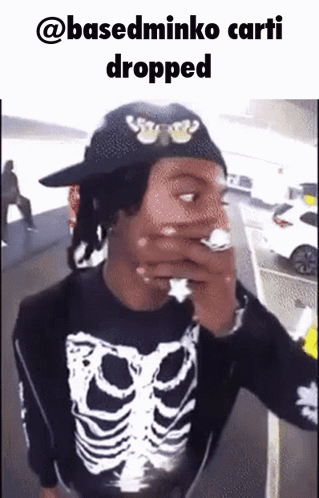 Man in Skeleton Shirt Smoking Cigarette Hat Saying @Basedminko Carti Dropped