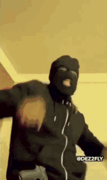 Man in Ski Mask and Black Hoodie