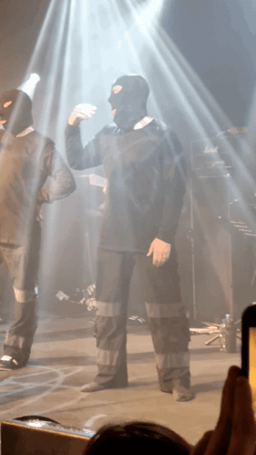 Man in Ski Mask Dancing on Stage