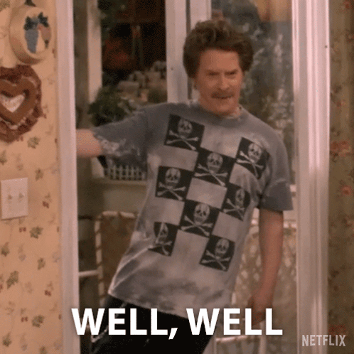 Man in Skull and Crossbones T-Shirt in Doorway