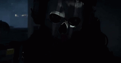 Man in Skull Mask and Headphones in Car