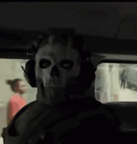Man In Skull Mask And Headphones Sitting In Car GIF