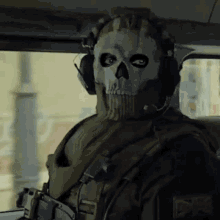Man In Skull Mask Sitting In Car With Headphones GIF