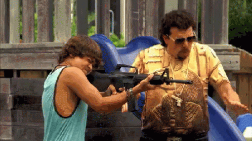Man in Snake Shirt Pointing Gun at Tank Top Man