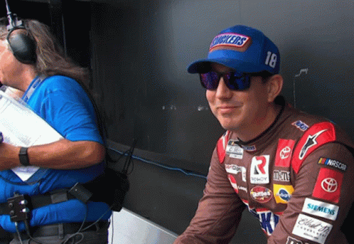 Man In Snickers Hat And Sunglasses In Garage GIF