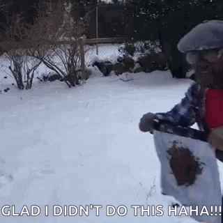 Man In Snow Holding Shovel And Paper GIF