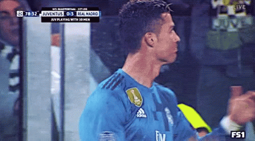 Man in Soccer Jersey Number 7 Walking Through Crowd