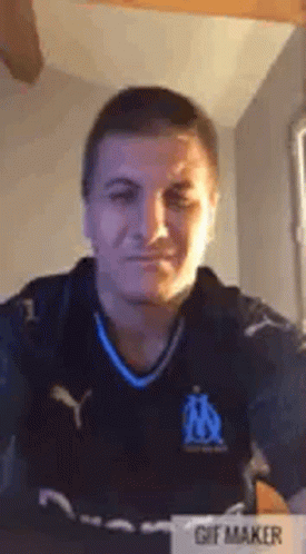 Man in Soccer Jersey Taking Selfie